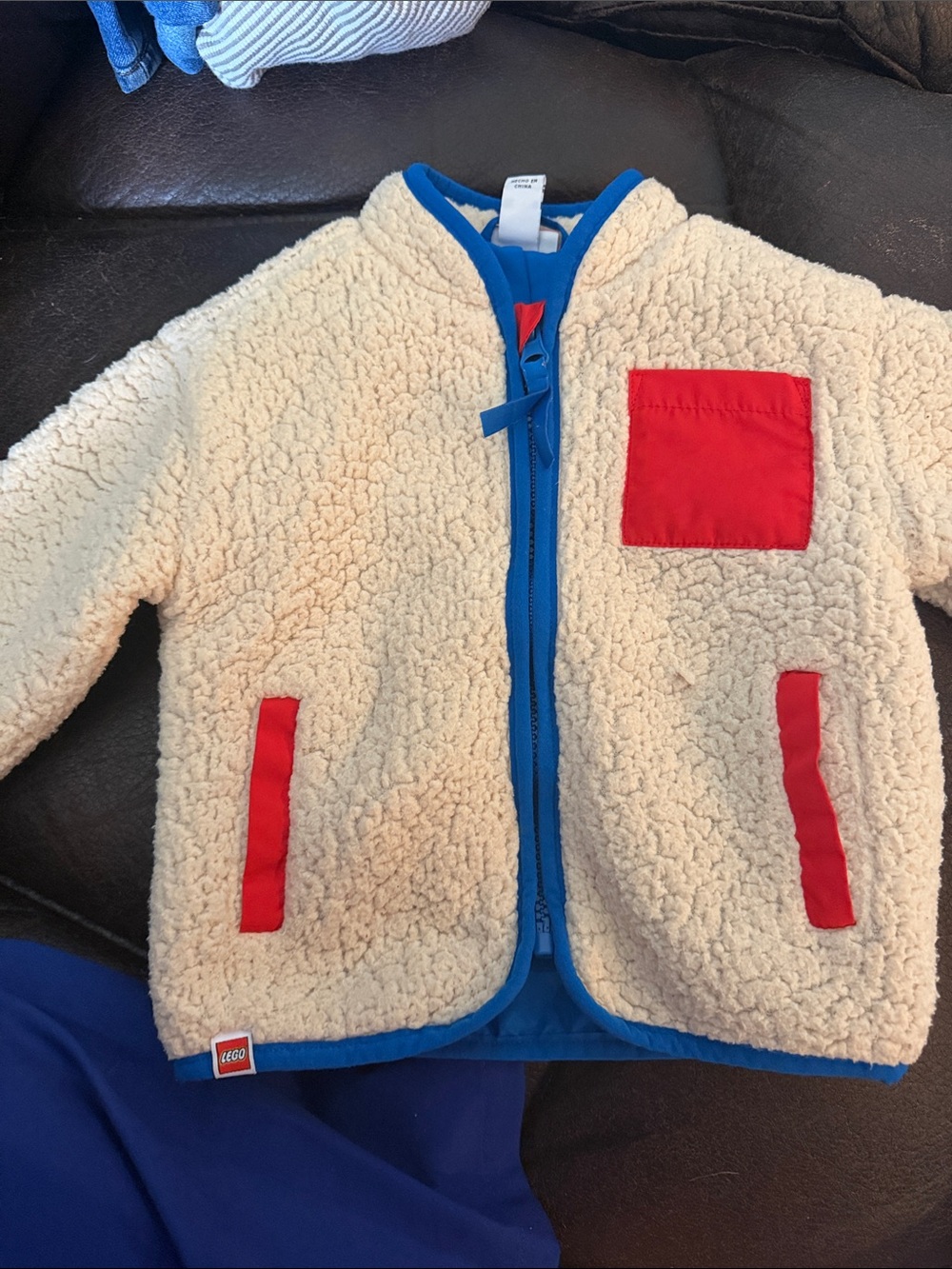 Lego Cream Sherpa Jacket with Blue Trim and Red Pockets